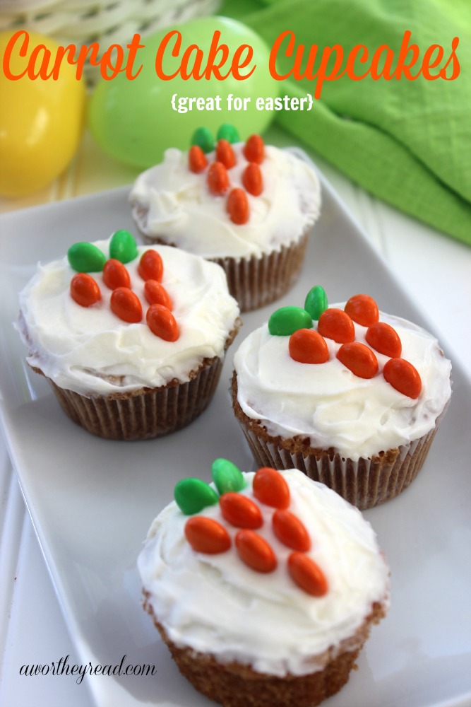  carrot cake cupcakes with M & M carrots on top