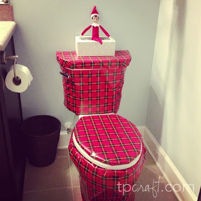 Elf wraps the toilet