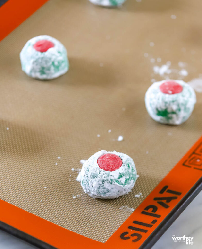 green cookies on baking sheet