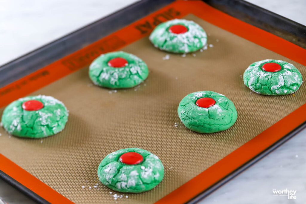 out of the oven green cookies on baking sheet