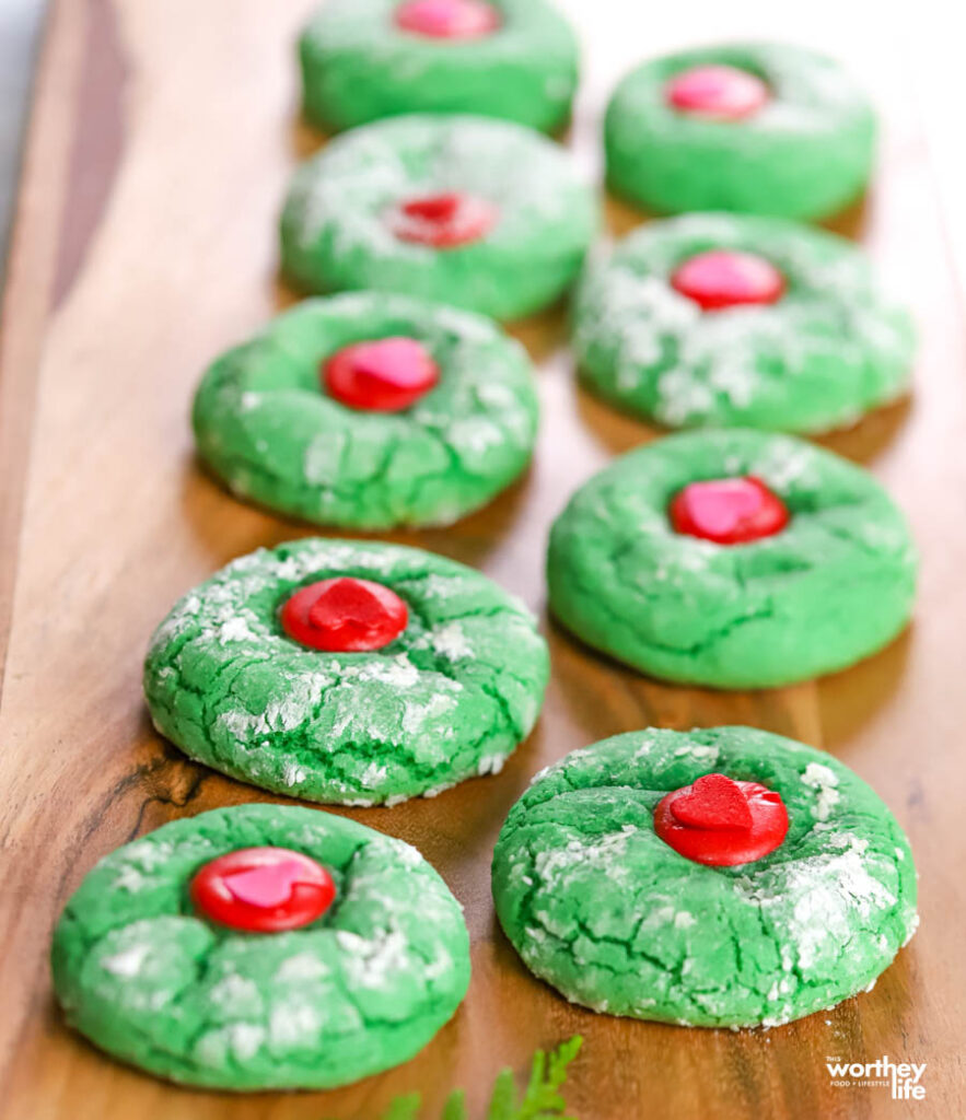 two rows of Grinch Crinkle Cookies on board