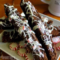 This Peppermint Chocolate Biscotti Recipe is perfect for hoarding sharing with friends and family, or packaged up in a clear cellophane treat bag tucked inside a pretty mug and given as a gift.