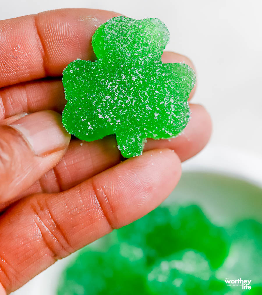 Shamrock gumdrop on a hand