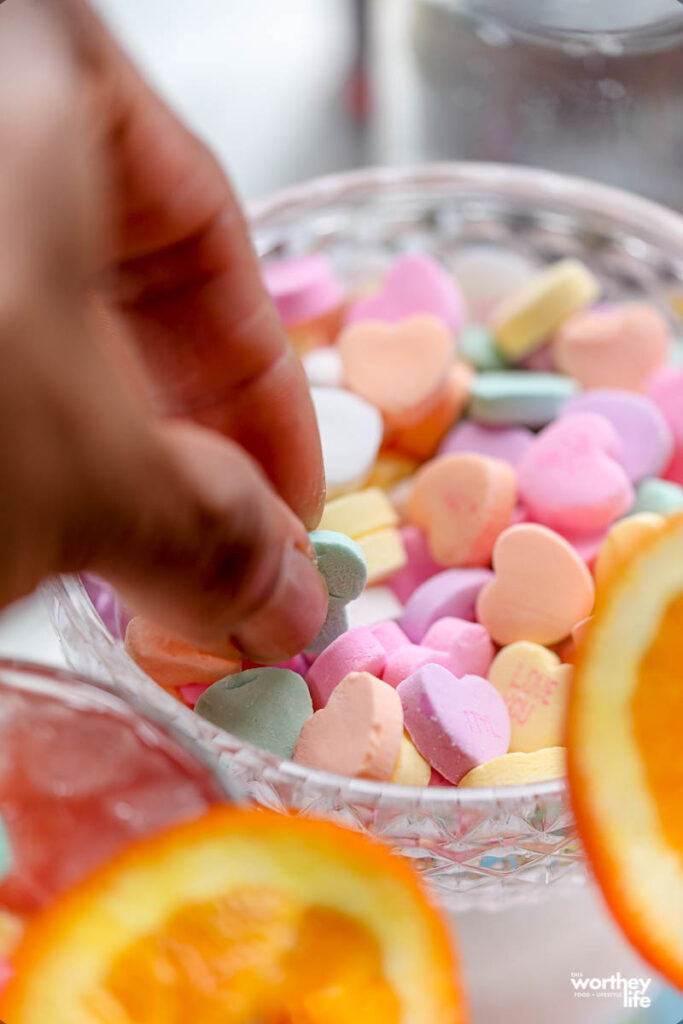 picking up valentine's day candy out of bowl