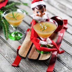 Elf on the Shelf Drink Idea: Apple Ginger Sour Mocktail with Rosemary Your Elf on the Shelf will be tired from running back and forth to the North Pole. Let him relax with this Christmas mocktail drink idea!