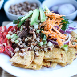 Ring in the New Year with this lucky meal: pork, greens and black eye peas. Plus, it's an easy Nacho recipe you can make any time of the year- Lucky Pork & Black Eye Peas Nachos