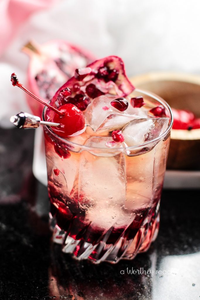 Our Pom Cherry Whiskey cocktail is a mix of Pomegranate, Cherry, and a little whiskey and swirled together with a secret ingredient. This whimsical drink is great for a nightcap, or an impressive way to wow your party guests. Either way, this refreshing whiskey drink is one to add to your cocktail menu bucket list. Can you guess what the secret ingredient is?