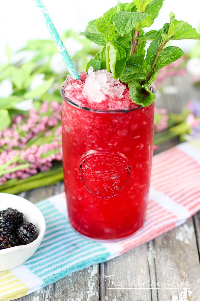 Our version of the frozen cherry + blackberry mint julep is a copycat to the original recipe from Oak Alley Plantation. Try this frozen mason jar drink this summer!
