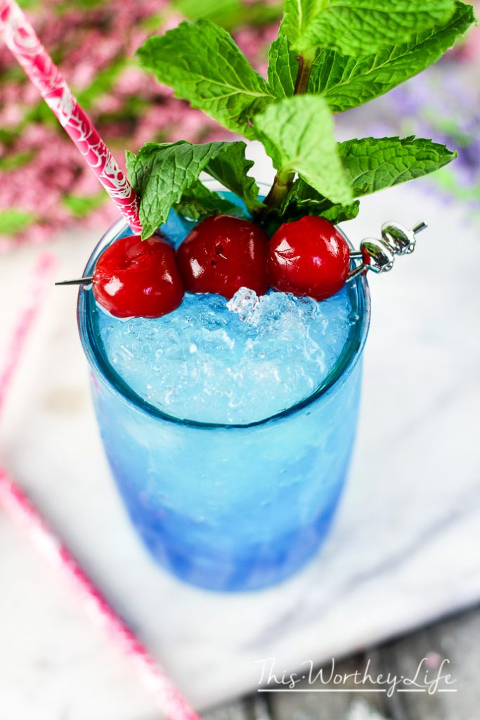 This blue drink is a great summer mocktail idea! Plus any drink served in mason jar says summer drink! Try our Frozen Blue Rose Mint Julep Mocktail Recipe Great mocktail recipe for kids and adults!