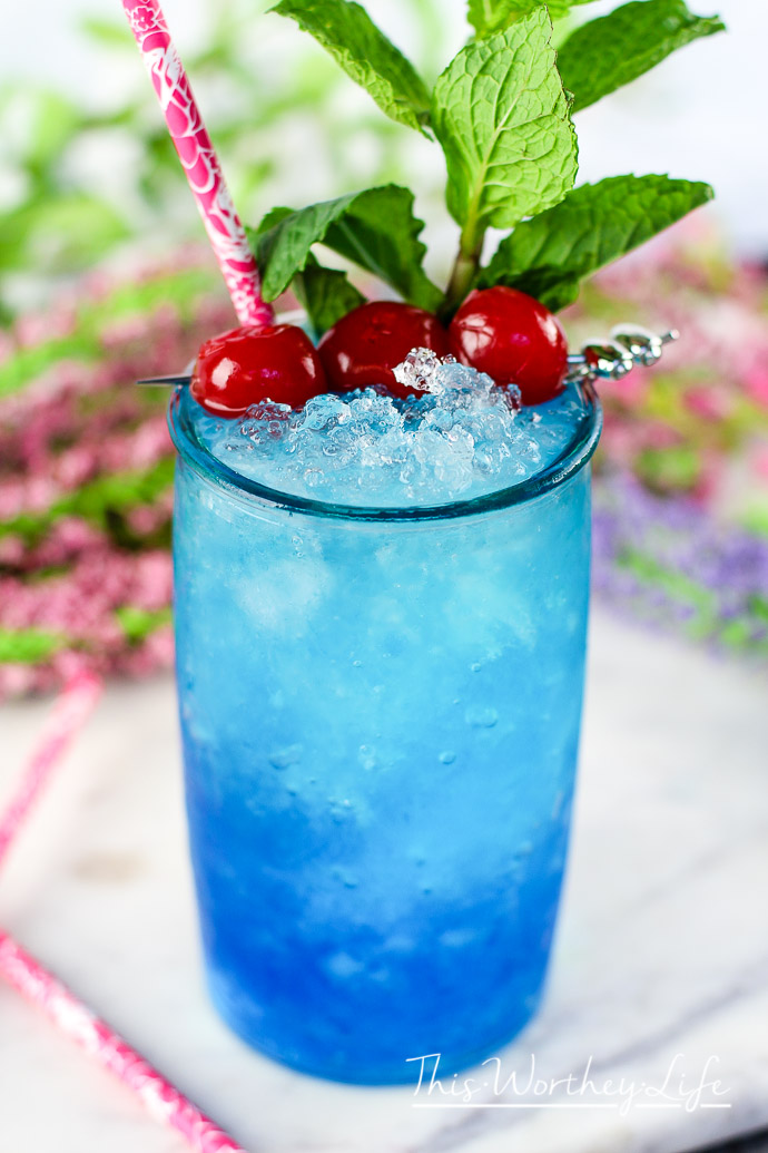 This blue drink is a great summer mocktail idea! Plus any drink served in mason jar says summer drink! Try our Frozen Blue Rose Mint Julep Mocktail Recipe Great mocktail recipe for kids and adults!