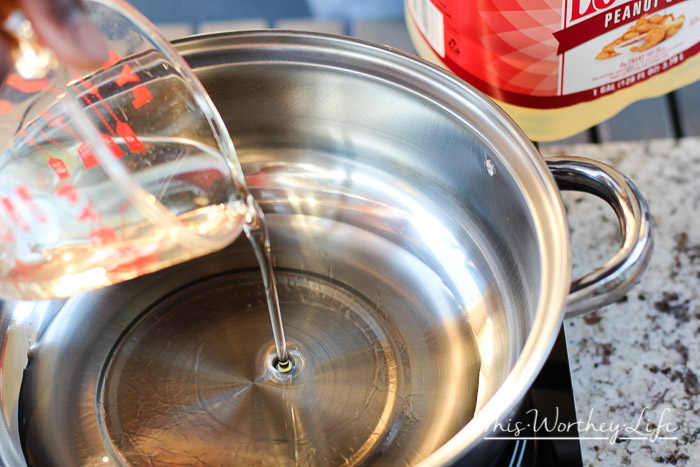 Pouring oil into a pot