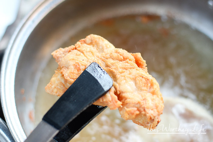 Pulling Savory Chicken out of the oil