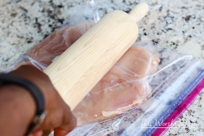 how to fry chicken- using a rolling pin to flatten chicken breasts in ziploc bag