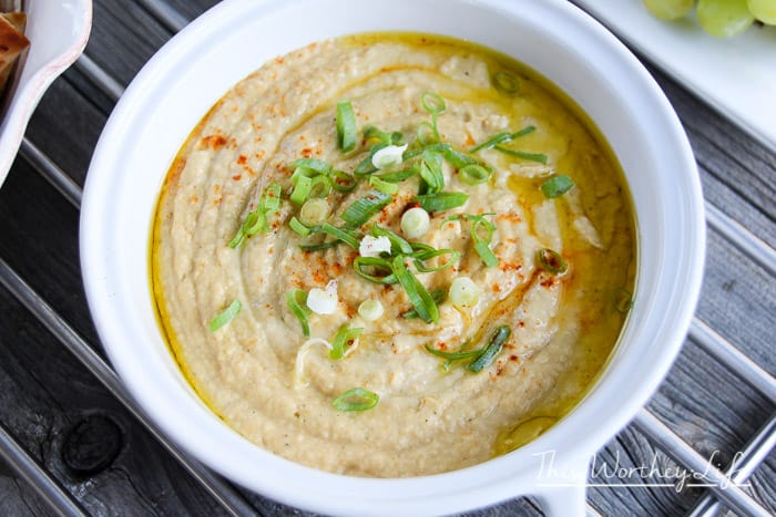 Our Hummus + Artichoke Dip is so easy to make.  Made with chickpeas, tahini, artichokes, and a little slicing, and dicing, then the food processor does the rest. Hummus lovers, unite! Dip it real good!