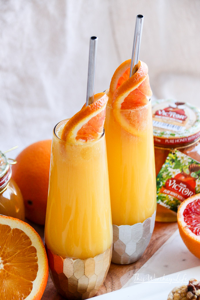 Ring in the New Year with a Honey Orange Mimosa Cocktail. Paired with a Honey Walnut Cookie, these recipes are great for parties, a girl's night out, brunch, or breakfast and dessert in bed. 