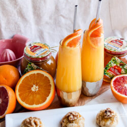 Ring in the New Year with a Honey Orange Mimosa Cocktail. Paired with a Honey Walnut Cookie, these recipes are great for parties, a girl's night out, brunch, or breakfast and dessert in bed. 