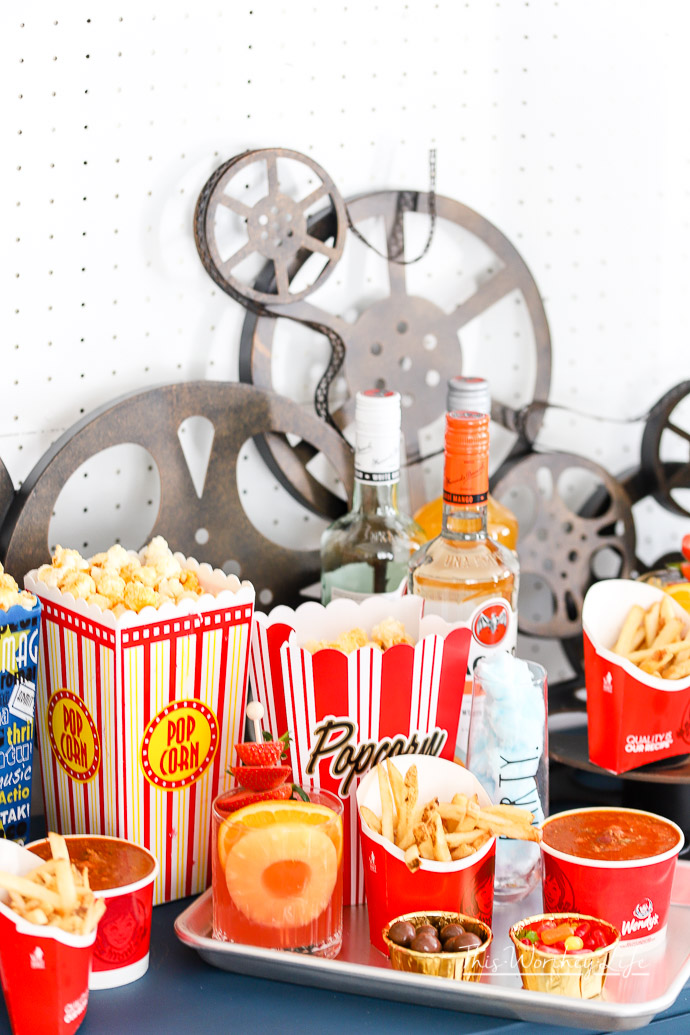 Create your own movie night-in party with snacks, popcorn, and drinks with our party ideas listed below. We're reminiscing about the drive-in movie days and created an easy movie night party idea for our friends and family!