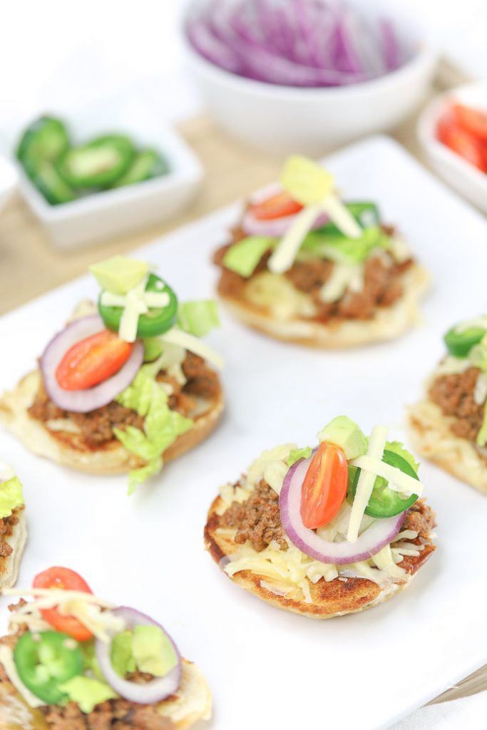 Slider recipes are pretty popular around here. We mixed our regular tacos and sloppy joes' to make Taco Sloppy Joe Sliders. They were a huge hit at our game day party, plus they are easy appetizers to make for any type of party or dinner! Grab the taco sloppy joe sliders recipe down below. 