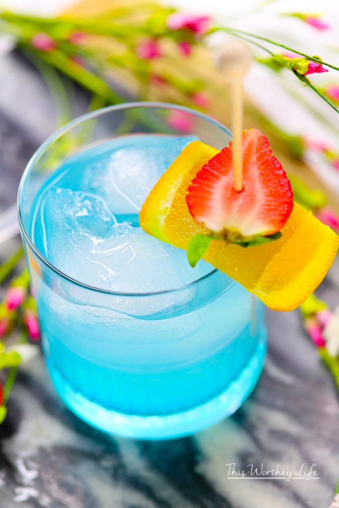 Toast to Marvel's Black Panther movie with our Vibranium cocktail made with hpnotiq liqueur. This hpnotiq drink is a beautiful, pastel blue drink- perfect to serve at any party. Cheers to Marvel's Black Panther movie, featuring a black superhero! 