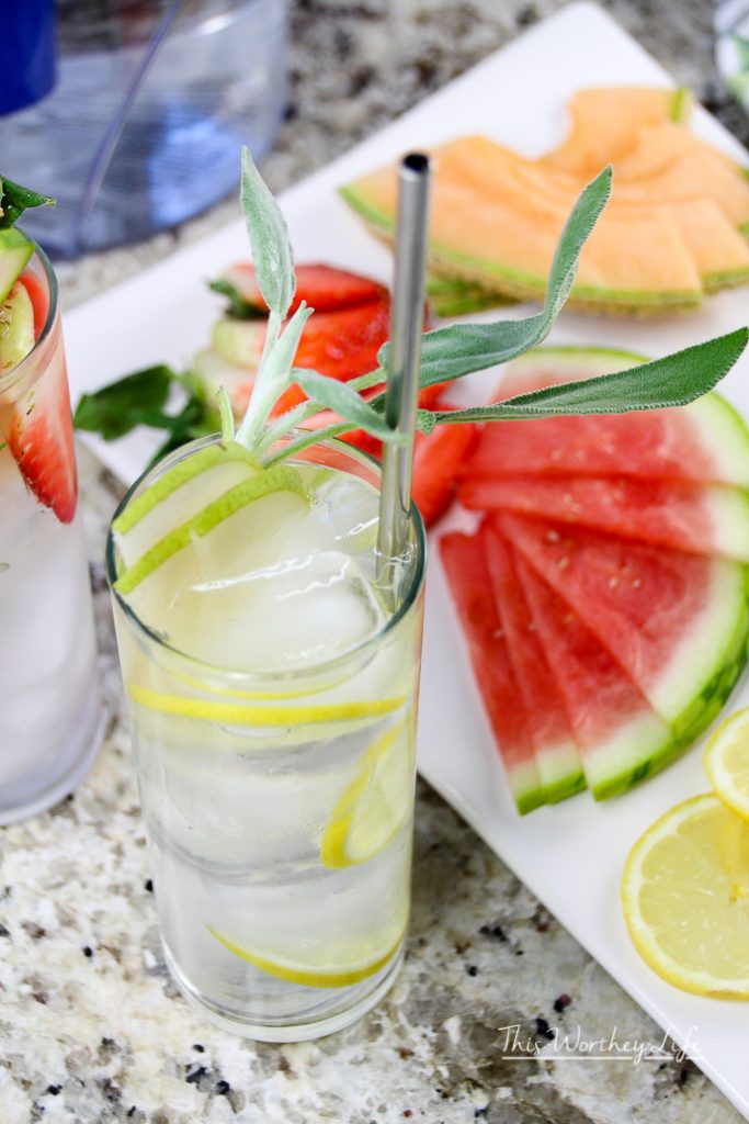 Glass of water on counter, sharing creative ways to drink more water. 