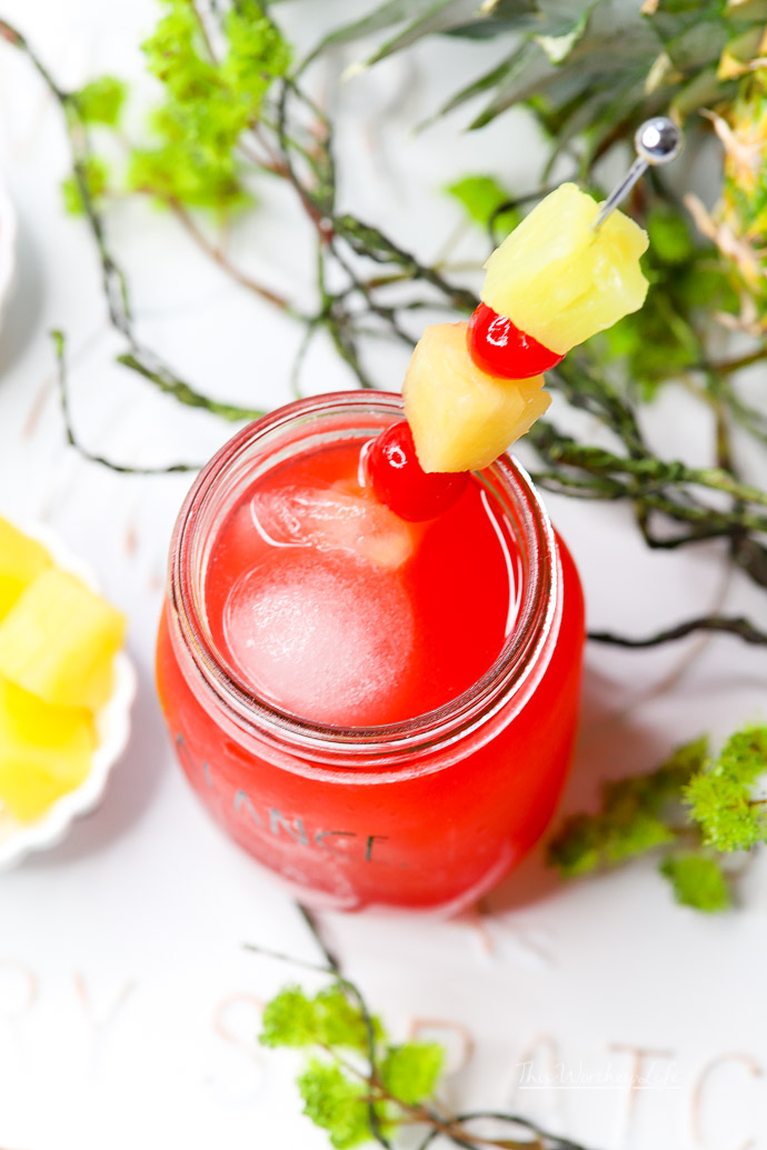 Get ready to cool off with this summer mason jar drink idea. It's a kid-friendly punch with pineapple juice, black raspberry sparkling ice, lavender syrup, and a few other fun ingredients for a sweet, fresh drink! Grab the recipe for this summer mocktail on the blog!