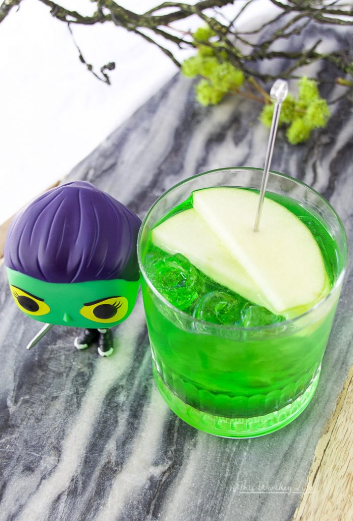 We're dedicating this green apple vodka to Gamora, first seen in Guardians of the Galaxy. Gamora plays an important role in Infinity War, and we get to see quite a bit of dialogue between Gamora and Thanos. This Honeycrisp vodka mixed with Midori Melon and green apple soda pays homage to Gamora.