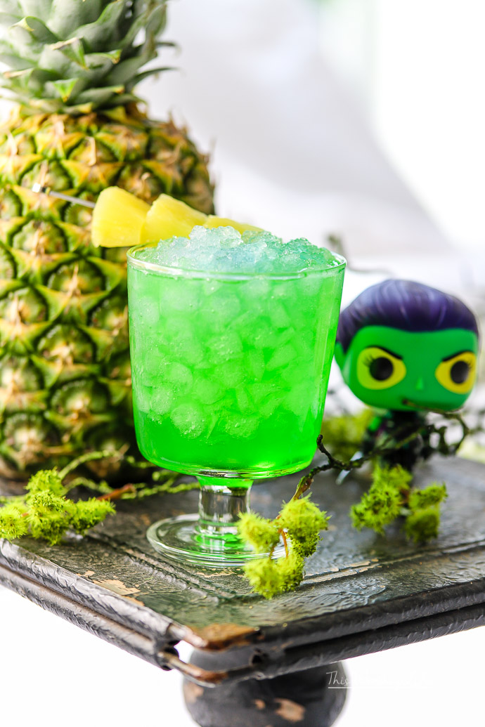 This fun kid-friendly green drink has pineapple juice, green apple syrup, and lemon-lime soda to make a Guardians of the Galaxy drink featuring Gamora! Check out how to make this fun green pineapple mocktail on our recipe blog. 