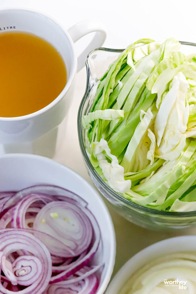 fresh cabbage with onions and chicken broth
