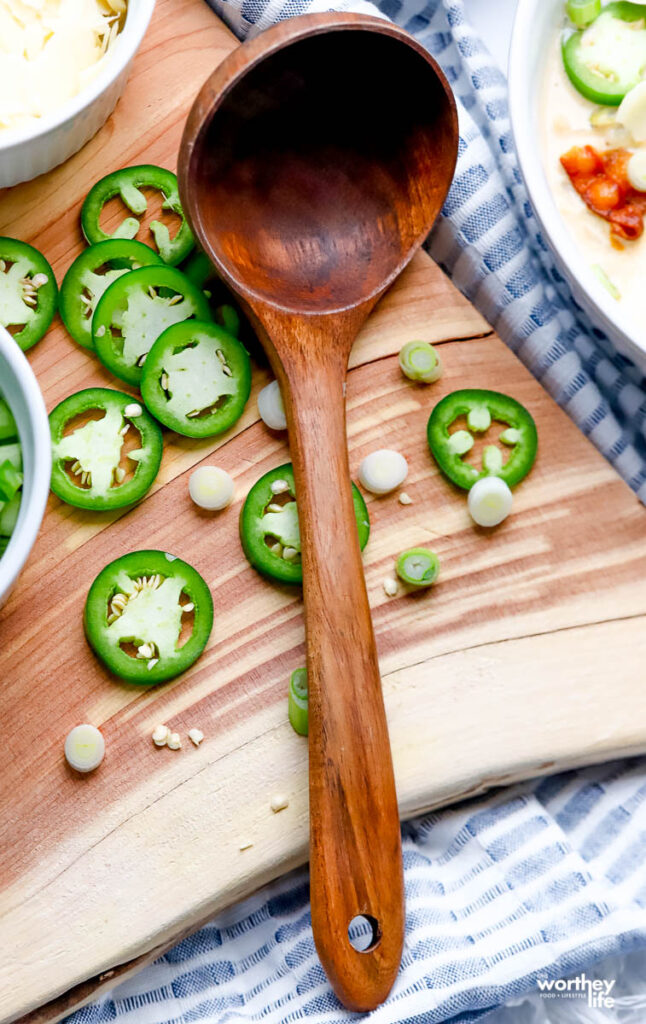 fresh peppers on a wood cutting board