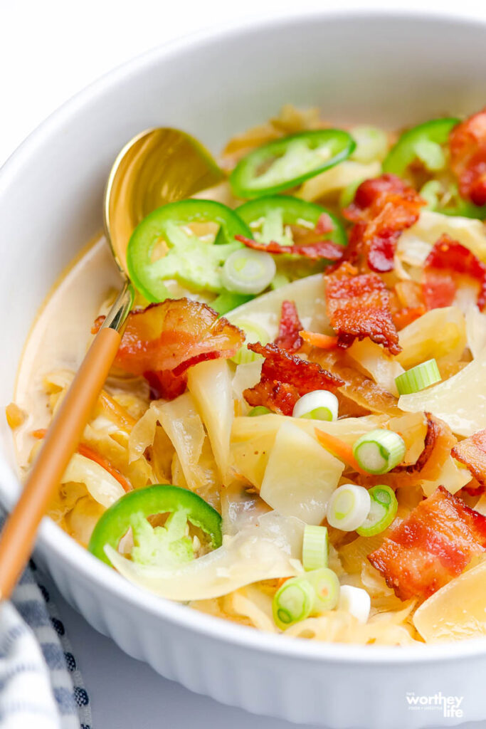 up close photo of soup with fresh veggies and bacon