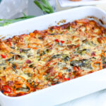 Take breakfast to a new level with our loaded bacon + peppers breakfast strata! Oozing with a variety of cheeses, fresh peppers, thick-cut bacon, collard greens, onions and more, this loaded strata says, breakfast is served!