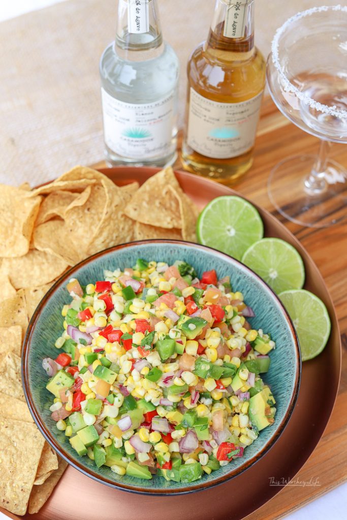 Keep the sweet taste of summer going with our mouthwatering appetizer, Sweet Corn Pico de Gallo. A great dish for game day, tailgating, or a fresh snack! Mixed with sweet corn, tomatoes, avocado, and other fresh veggies, this pico de gallo recipe is one you will want to make again and again!