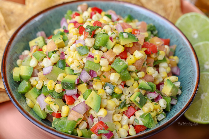Keep the sweet taste of summer going with our mouthwatering appetizer, Sweet Corn Pico de Gallo. A great dish for game day, tailgating, or a fresh snack! Mixed with sweet corn, tomatoes, avocado, and other fresh veggies, this pico de gallo recipe is one you will want to make again and again!