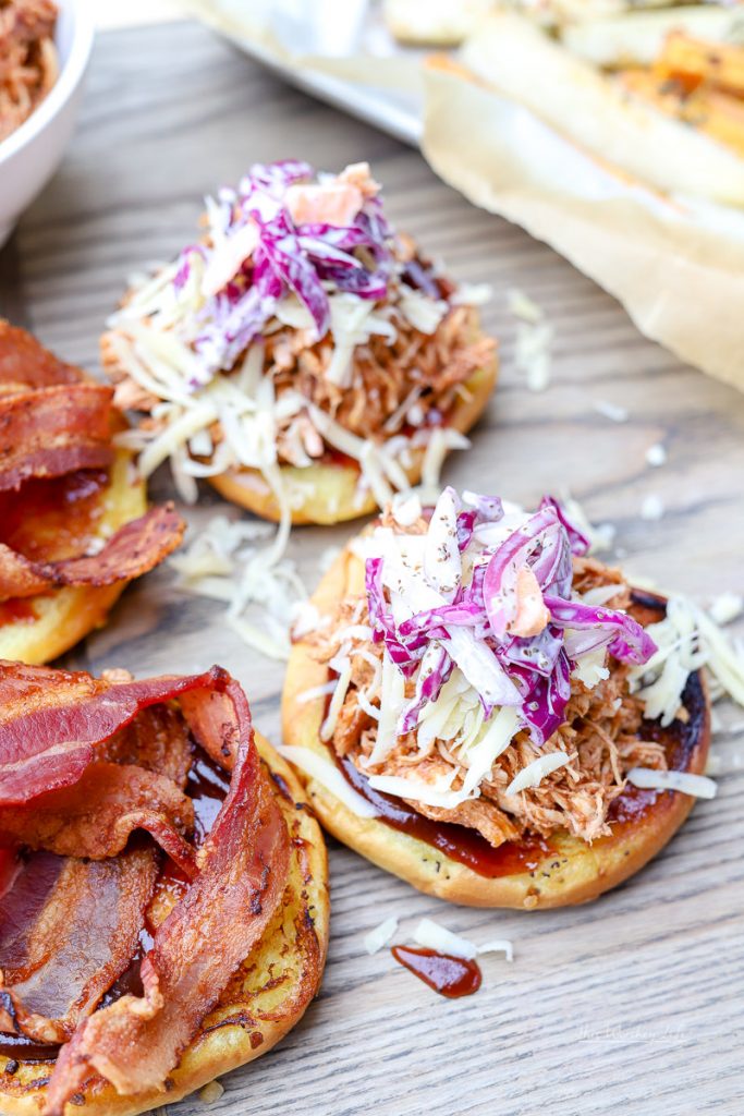 BBQ Pulled Chicken Sandwiches are a great appetizer for game day parties, BBQ outings, and any other time when you're feeling in the mood for BBQ chicken. Topped with coleslaw and bacon, you can't go wrong with these Kansas City BBQ Pulled Chicken Sandwiches.