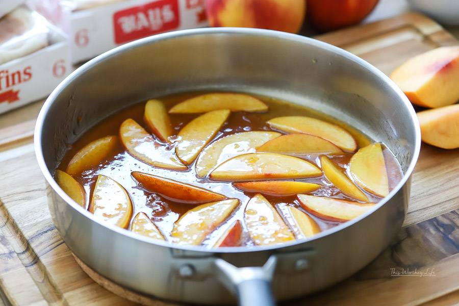Cooked peaches in skillet