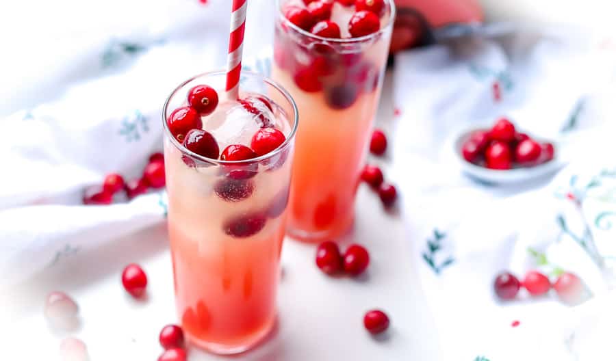 This Cranberry Orange mixed drink is great for the whole family. The perfect holiday mocktail to serve this year, adding fun and cheer to your holiday party.