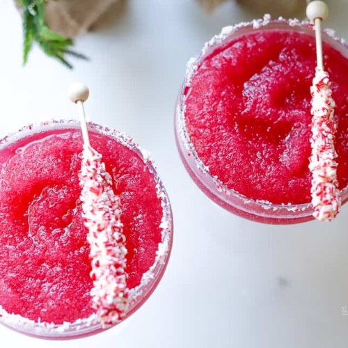 Our Frozen Cranberry Margarita is a festive holiday cocktail, arriving just in time to greet St. Nick and your Christmas party festivities. We're adding a peppermint rim to this Cranberry Margarita.