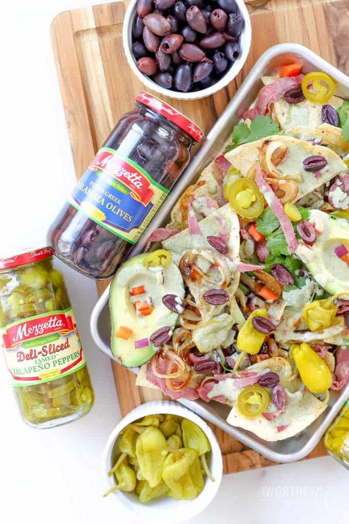 Get ready for game day with our nacho recipe! Create a unique nacho dish with peppers, corned beef, and a delish cheesy spinach sauce! Get ready for The Big Game with Mezzetta and our totally delicious out of this world Corned Beef + Cheesy Spinach Sauce.