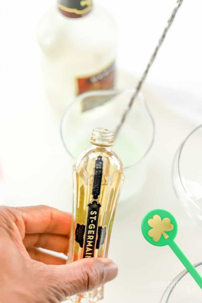 bottle of germaine being poured into a shaker