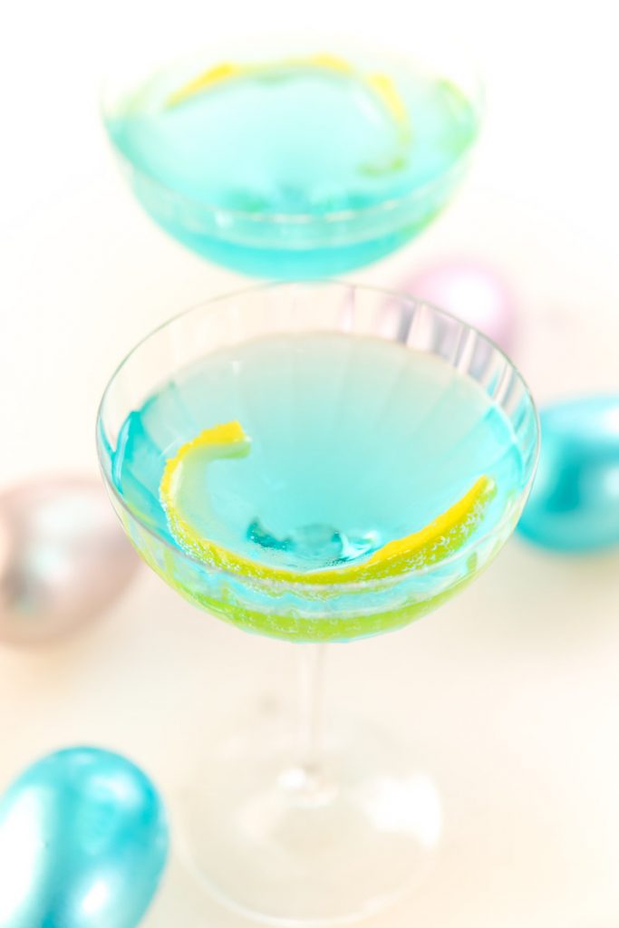 Get ready for Easter with our Blue Sunday Cocktail. Made with gin, Blanc de Bleu Sparkling Wine, and a few other ingredients, this blue cocktail will be perfect to serve for Easter dinner or a Spring brunch. 