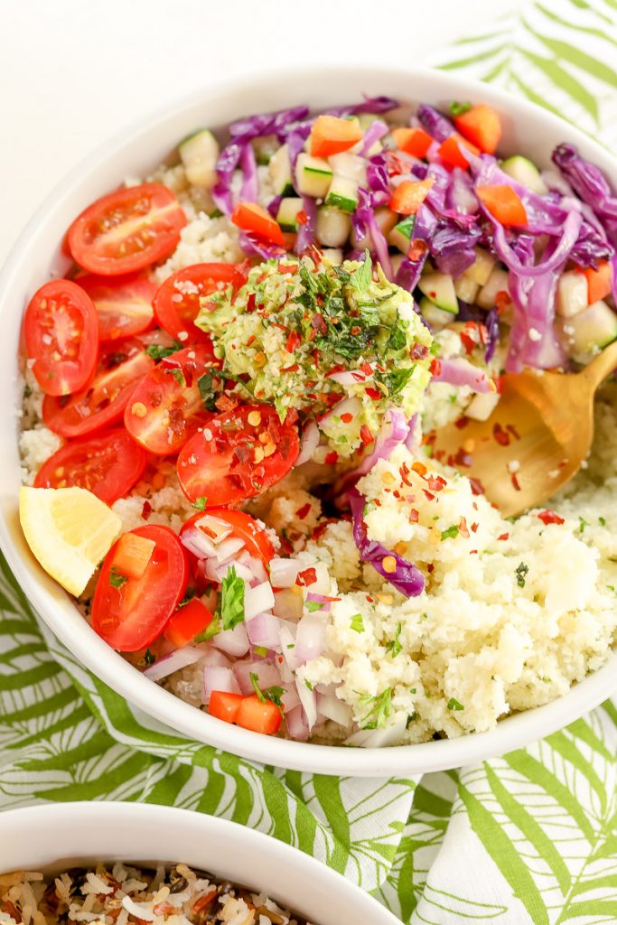 Summertime is all about eating the rainbow! This colorful rice bliss bowl is full of fresh, delicious veggies straight from the garden, grocery store, or your farmer's market. We're sharing two ways to enjoy this bliss bowl, with rice or cauliflower.