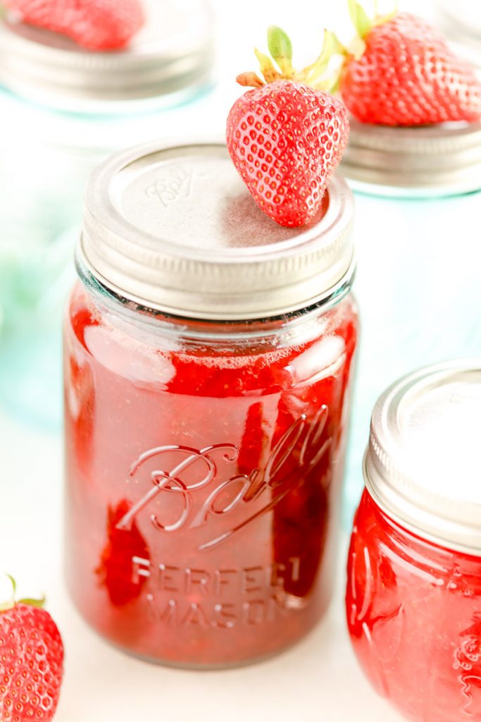 fresh strawberry jam made with pectin in ball canning jar