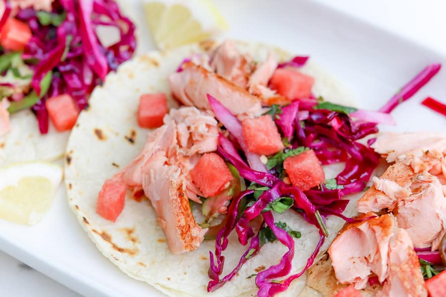 Warm flour tortillas make these fish tacos into little warm pockets of joy!