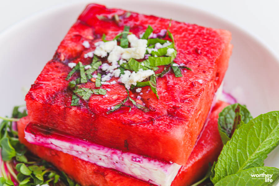 stacks of watermelon and cheese on white plate