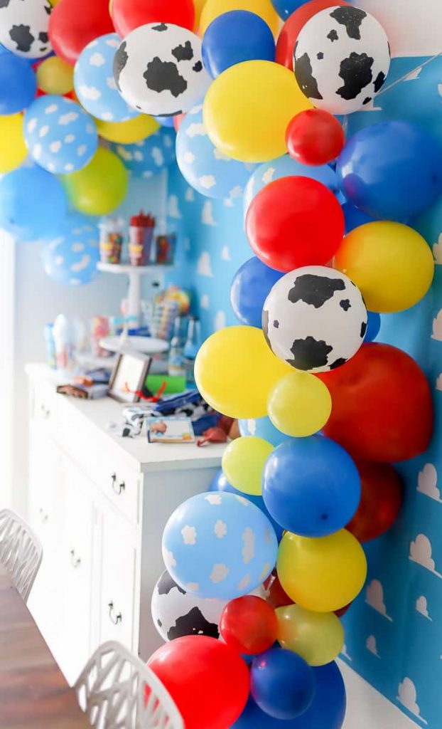 Plan a fun Toy Story themed party with a Toy Story Balloon garland. I'm sharing how to create a balloon garland with a Toy Story theme. It's the perfect pop to any themed party.