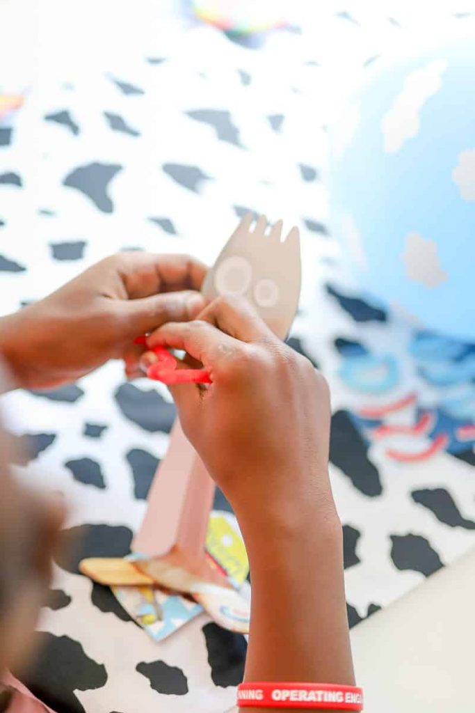 child's hands making a forky