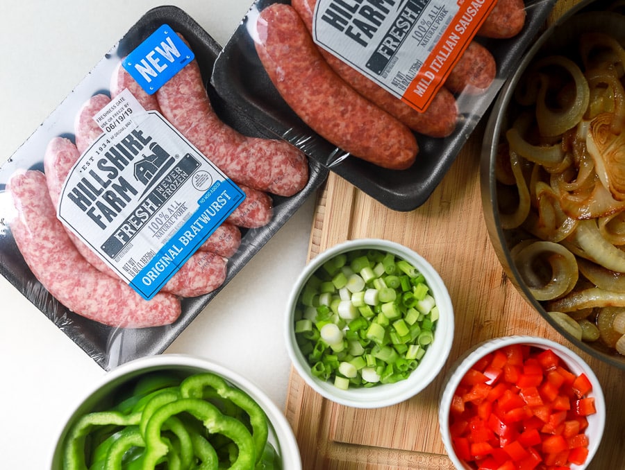 Get ready to enjoy summer parties with fresh brats from Hillshire. I'm sharing two summer recipe ideas using fresh brats - Loaded Baked Beans + Brats and Savory Philly Cheesy Brats