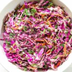 Upgrade your coleslaw with our tangy, bright, and zero mayonnaise Lemon Herbed Aioli Coleslaw! It comes together in no time and will take your side game to the next level at your next cookout. Promise! 