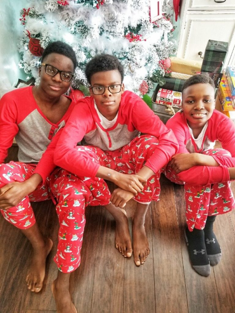 Christmas Truck In Matching Family Pajamas With Pet Blue White