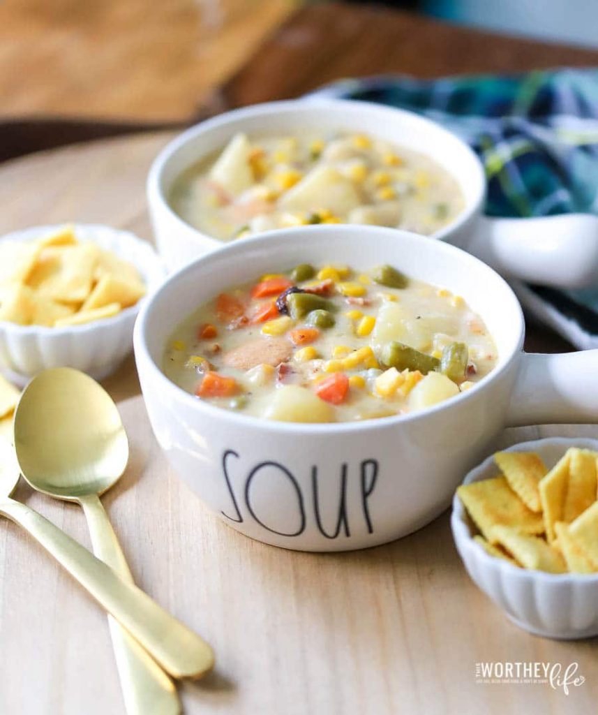 Hearty vegetable soup- corn, potato, sausage in a Rae Dunn soup bowl